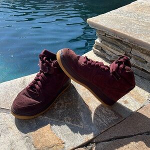 Barely worn. Slight crease. Youth size 4Y. Nike Air Force Burgundy